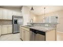 Modern kitchen with stainless steel appliances and granite countertops at 12460 Shimmering Oak Cir, Venice, FL 34293