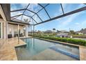 Inviting pool and spa with a covered lanai overlooking the canal at 1371 Grebe Dr, Punta Gorda, FL 33950