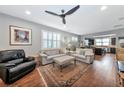 Spacious living room with hardwood floors and an open floor plan at 13836 Alafaya St, Venice, FL 34293