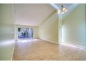 Spacious living room with tile floors and sliding glass doors at 2066 Sunset Point Rd # 91, Clearwater, FL 33765