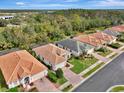 Community overview showcasing several homes with similar architectural styles at 2136 Mesic Hammock Way, Venice, FL 34292