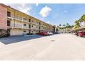Two story building with parking in front at 2280 Stickney Point Rd # 437, Sarasota, FL 34231