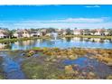 Community features a lake with fountain and well-maintained landscaping at 4206 Vicenza Dr # C24, Venice, FL 34293