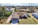 House with a fenced backyard and driveway in a residential neighborhood at 4611 Crabapple Ave, North Port, FL 34287