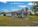 Screened-in pool area with lush landscaping at 5280 Rolla Rd, Venice, FL 34293