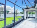 Spacious screened patio with backyard view and lush green grass at 5552 Guest Ter, Port Charlotte, FL 33981