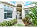 Inviting front entrance with a white door and decorative wreath at 560 Fallbrook Dr, Venice, FL 34292