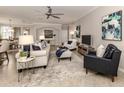 Spacious living room with comfortable seating and large TV at 10792 Tarflower Dr # 202, Venice, FL 34293