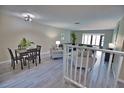 Bright dining area with modern furniture and grey wood-look flooring at 1437 57Th W St # 1437, Bradenton, FL 34209