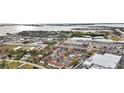 Aerial view showing complex near water and shopping at 1531 Placida Rd # 1-103, Englewood, FL 34223