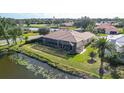 Backyard oasis with pool, screened enclosure & water view at 256 Royal Oak Way, Venice, FL 34292