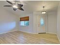 Living room with hardwood floor and ceiling fan at 3187 Galiot Rd, Venice, FL 34293