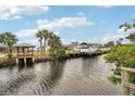 Relaxing canal view with a boat dock and gazebo at 4310 Albacore Cir, Port Charlotte, FL 33948
