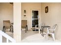 Inviting front porch with seating for two, perfect for relaxing at 5800 Sabal Trace Dr # 701, North Port, FL 34287