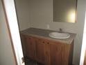 Clean bathroom with a single sink vanity and tub shower at 8426 Sweden Blvd, Punta Gorda, FL 33982