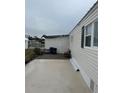 Manufactured home with shed and patio area at 863 Baveno Dr, Venice, FL 34285