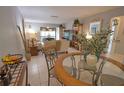 View of dining area, living room and entryway at 1640 Stickney Point Rd # 202, Sarasota, FL 34231