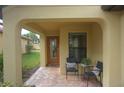 Covered entryway with seating area and a view of the backyard at 19155 Mangieri St, Venice, FL 34293