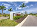 The Isles community entrance with lush landscaping and signage at 1932 W Isles Rd, Port Charlotte, FL 33953