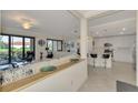 Open floor plan with modern kitchen and spacious living area at 23210 Banbury Way # 101, Venice, FL 34293
