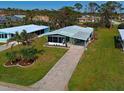 Aerial view of mobile home and surrounding community at 3036 Audubon Ave, Englewood, FL 34224