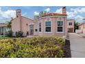 Spanish style home with driveway and lush landscaping, offering curb appeal at 321 Pedro St, Venice, FL 34285