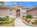 Welcoming entryway with a walkway leading to the front door at 430 Marsh Creek Rd, Venice, FL 34292