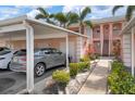 Condo building exterior showing walkway and carport at 458 Cerromar Rd # 483, Venice, FL 34293