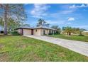 Exterior of house showcasing the garage and front yard at 519 Rubens Dr # 519, Nokomis, FL 34275
