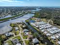 Wide aerial showcasing waterfront property and community at 809 Garland Ave, Nokomis, FL 34275