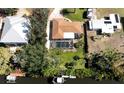 Aerial view showcasing a home's pool, canal views, and boat dock at 809 Garland Ave, Nokomis, FL 34275