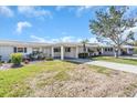 Front view of a house with walkway and landscaping at 833 White Cap Cir # 8, Venice, FL 34285