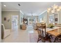 Bright dining room features a wooden table, chairs, and built-in hutch at 900 Paisley Ct # 1, Venice, FL 34293