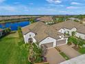 Luxury home with lake views and two-car garage at 11204 Mcdermott Ct # 11204, Englewood, FL 34223