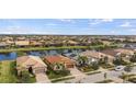 Aerial view of homes and a canal in a residential neighborhood at 13678 Yelma St, Venice, FL 34293