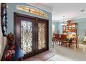 Open concept dining room with a large table and hutch at 1684 Ruiz St, North Port, FL 34286