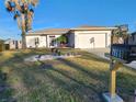 House exterior showcasing a front yard, driveway, and mailbox at 1789 Elm Dr, Venice, FL 34293