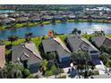 One-story house with a teal garage door and manicured lawn at 19374 Rizzuto St, Venice, FL 34293