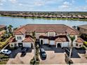 Aerial view of townhome community by the lake at 23108 Banbury Way # 202, Venice, FL 34293