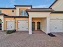 Three-unit townhome building with individual garages at 23108 Banbury Way # 202, Venice, FL 34293