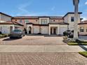 Townhome with two-car garage and brick paver driveway at 23108 Banbury Way # 202, Venice, FL 34293