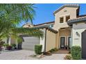 Front view of two-story home with double garage at 23471 Awabuki Dr, Venice, FL 34293