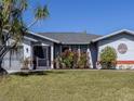 Charming single-story home with lush landscaping and a tree of life at 4060 Barbary Ln, North Port, FL 34287