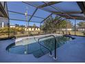 Inviting kidney-shaped pool with a screened enclosure at 4060 Barbary Ln, North Port, FL 34287