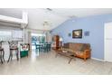 Open living room and kitchen with a view of the pool at 4695 W Price Blvd, North Port, FL 34286