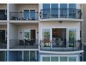 Private balcony with water views and access to condo amenities at 503 N Tamiami Trl # 301, Venice, FL 34285