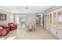 Bright dining room with white table and chairs, and built-in hutch at 6213 Green View Dr # 127, Sarasota, FL 34231
