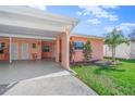 View of the home's exterior, carport, and landscaping at 6213 Green View Dr # 127, Sarasota, FL 34231