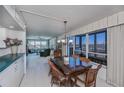 Open concept dining room with kitchen and living room views at 627 Alhambra Rd # 601, Venice, FL 34285