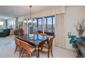 Dining room with glass-top table and view at 627 Alhambra Rd # 601, Venice, FL 34285
